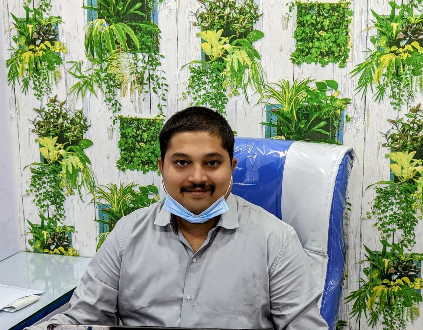 Dr. N. Surya Vamshi at his desk at Suryaini Dental Clinic