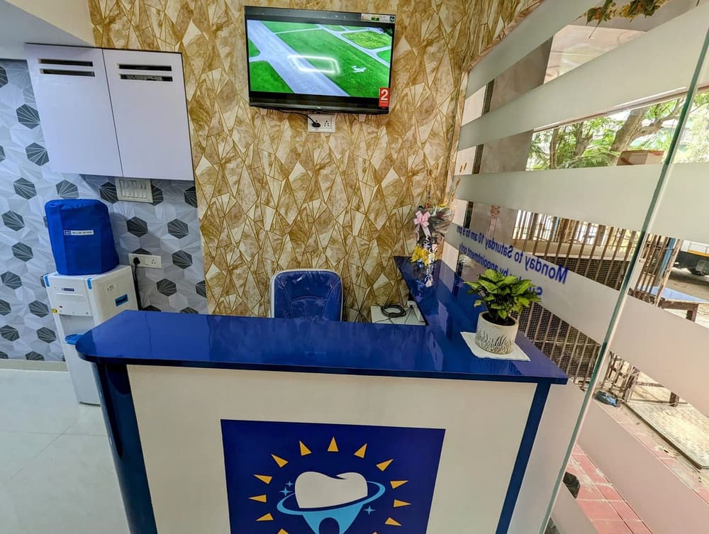 The blue reception desk with the Suryaini logo